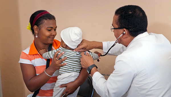 Health worker with clients in the Dominican Republic