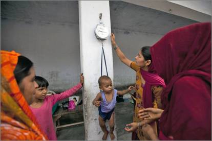 Child being weighed 