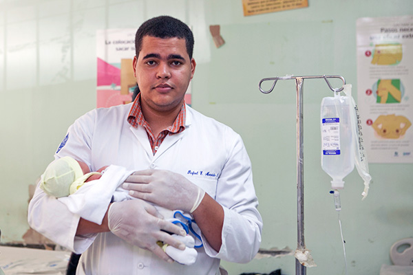 Health worker with baby in the Dominican Republic