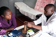 Health worker and client in Kenya