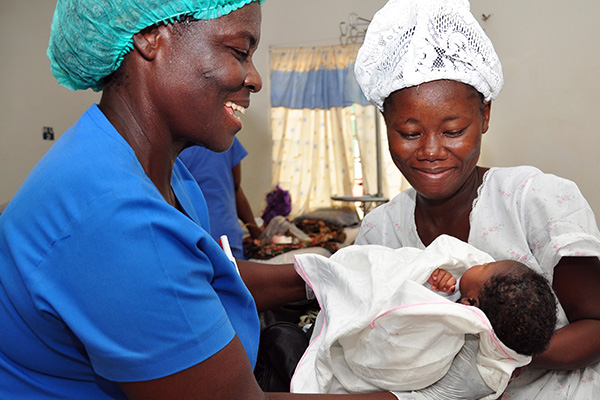 Health worker with client in Ghana