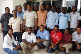 Dr. Juma Lungo (top left) poses with iHRIS users after a training in 2009. Photo courtesy of Carl Leitner.