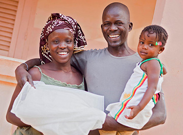 A family in Thiès, Senegal, after receiving their mosquito net. © 2012 Diana Mrazikova/Networks/Senegal, courtesy of Photoshare