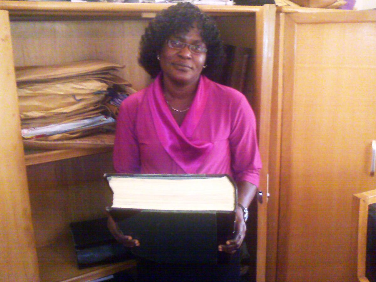 staff member with paper register